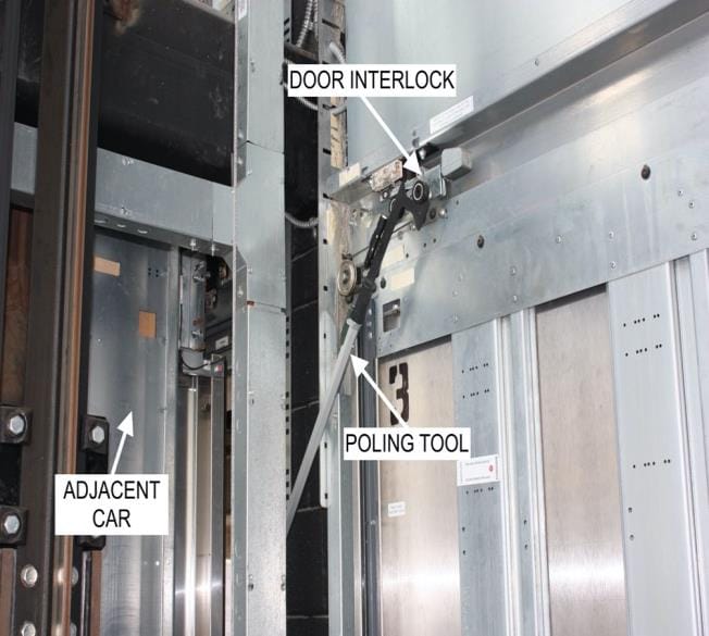 Poling tool reaching a door interlock from an adjacent elevator car
